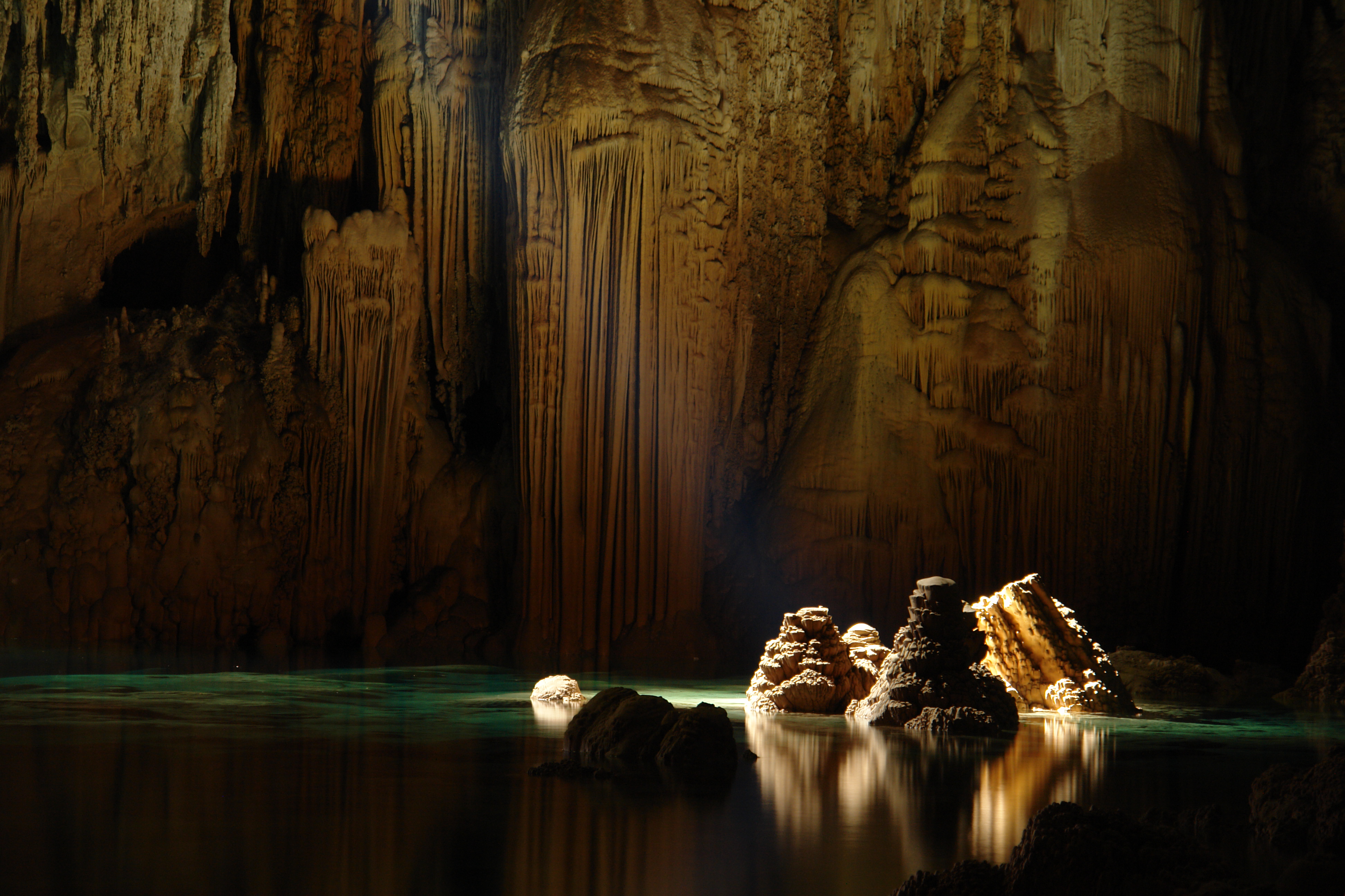 Limestone stalagmites inside the Anhumas abyss in Bonito, Mato Grosso do Sul, Brazil, by Caio Vilela (Caioribeirovilela).