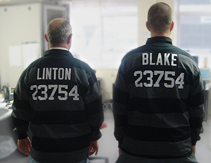 The INOC-DBA name-to-number distributed directory: Dial an Autonomous System Number to reach the network operations center responsible for that network. In this photo, Andy Linton and Simon Blake, of the Citylink fiber network in New Zealand, wear jerseys displaying their dialable autonomous system number, 23754. INOC-disributed-directory.jpg