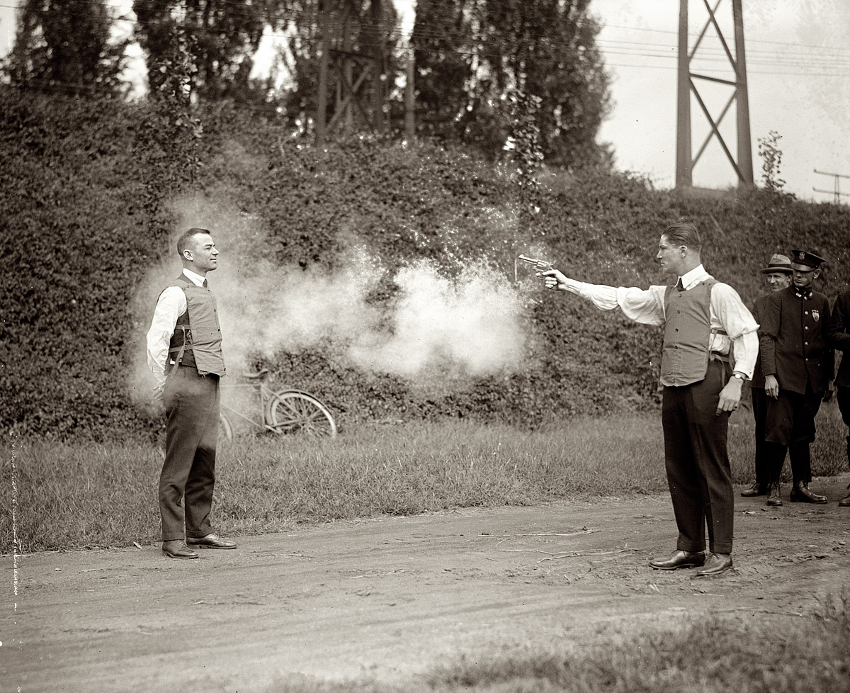 https://upload.wikimedia.org/wikipedia/commons/7/70/Testing_bulletproof_vest_1923.jpg