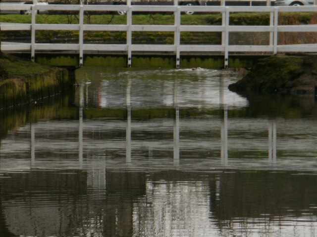 File:Footbridge across the pond - reflections - geograph.org.uk - 1727388.jpg