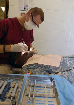 File:Hospital corpsman cleans teeth at Guantanamo.jpg