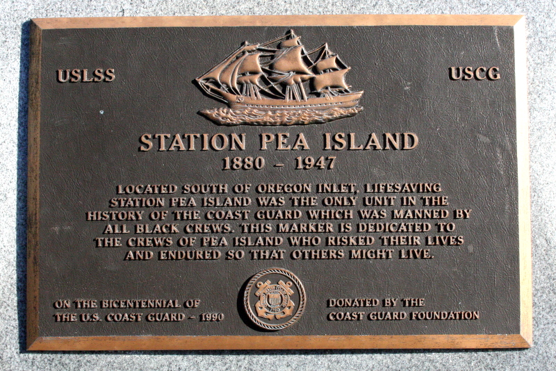 A plaque commemorating Pea Island Life Station. bronze edges with black placard. 
