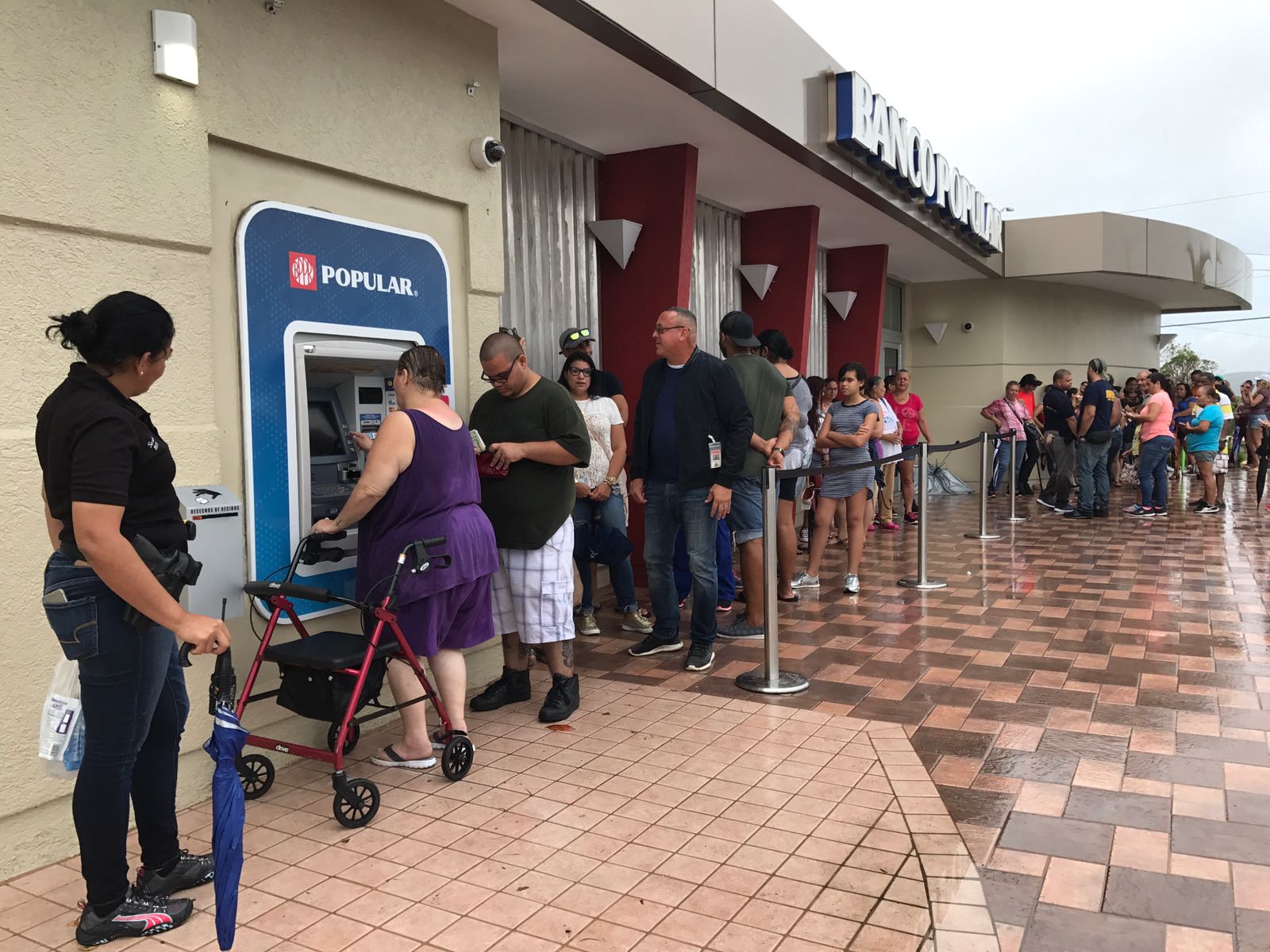 File:Residents of Ponce, Puerto Rico, line up at an ATM in hopes of getting  some