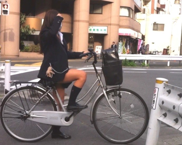 File:Stereotypical Japanese school girl in Japan on a bike - 2014.jpg