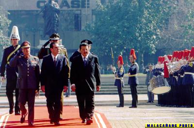 File:President Joseph "Erap" Ejercito Estrada, accompanied by his host, Chilean President Eduardo Frei, reviews the honor guards during formal welcome ceremonies held Thursday at the Plaza dela Constitucion in Santiago City, Chile.jpg