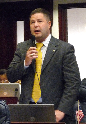 File:Brad Drake seeks the support of his colleagues for a measure considered on the House.png