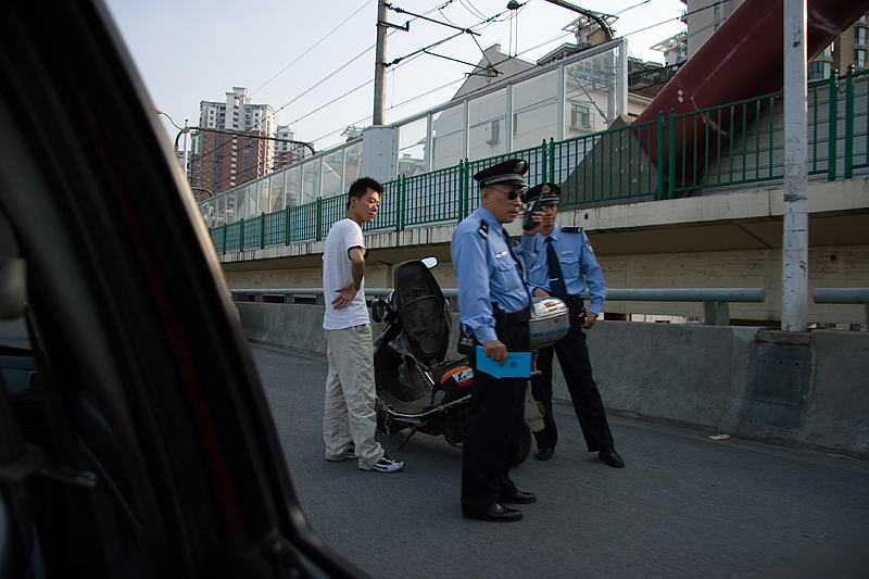 File:Shanghai police stop of scooter with LPG tank.jpg