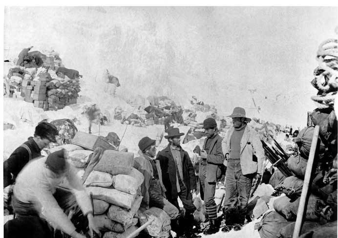 File:Men with piles of supplies at Chilkoot Pass, ca 1898 (MOHAI 7021).jpg