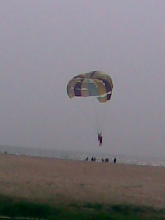 File:Parasailing at a beach.jpg