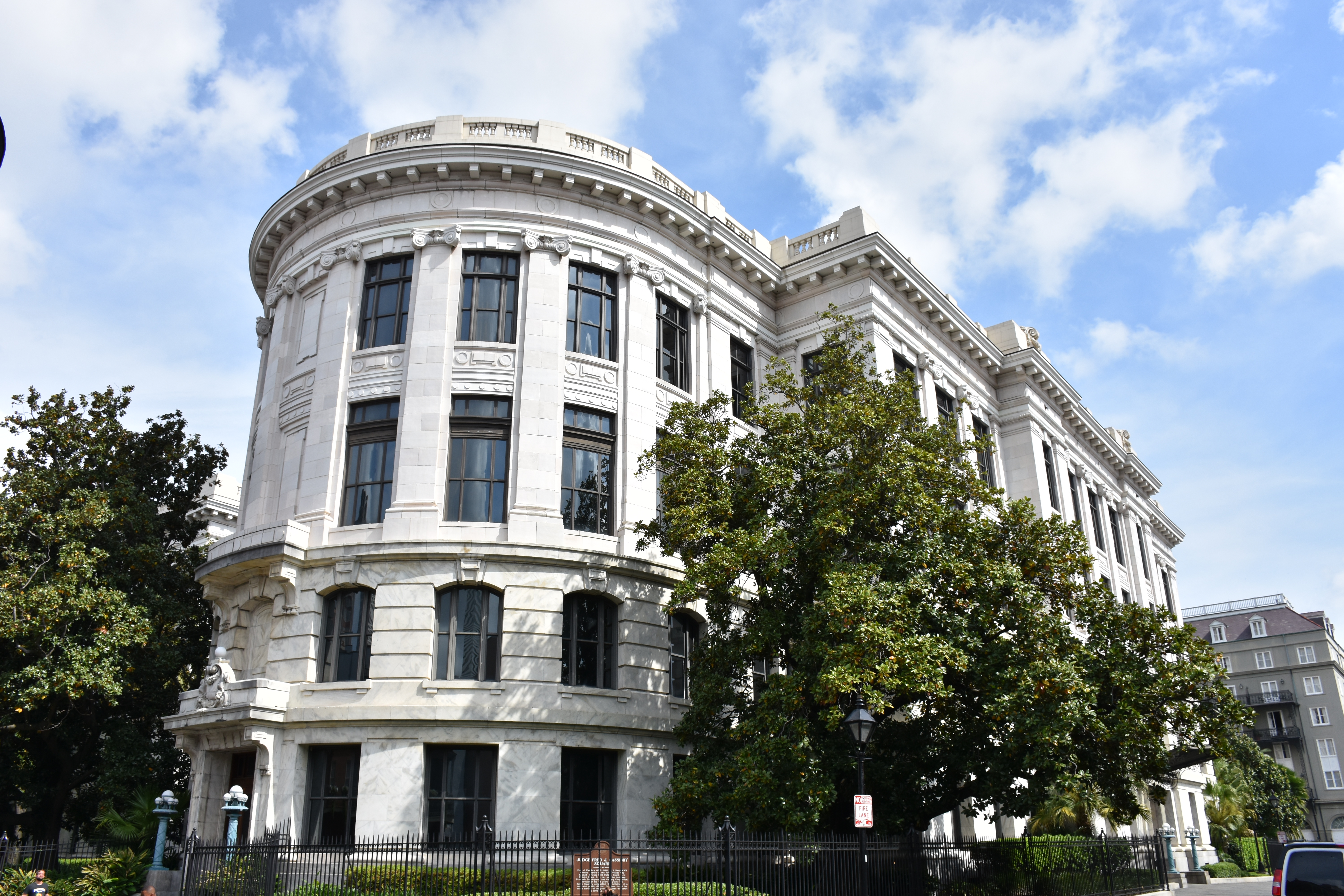 Panoramic image of Louisiana Supreme Court building with statue of