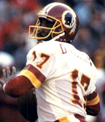 Williams attempting a pass for the Washington Redskins in 1987