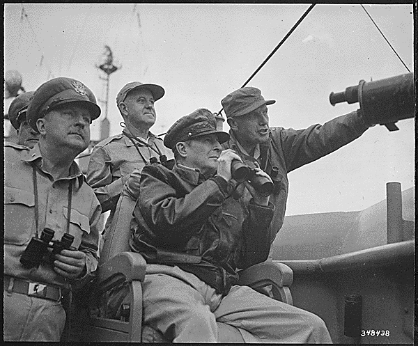 File:Brigadier General Courtney Whitney; General Douglas MacArthur, Commander in Chief of U.N. Forces; and Major General Edward Almond, observe the shelling of Inchon from the U.S.S. Mt. McKinley, September 15, 1950. - NARA - 531373.gif