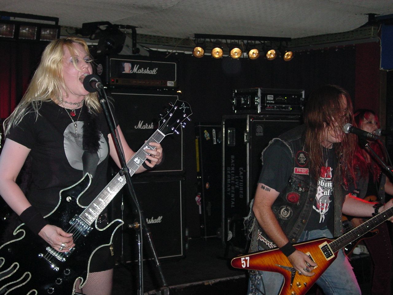 Fireball Ministry in 2004. L–R: Guitarist Emily Burton, vocalist/guitarist James A. Rota II, and bassist Janis Tanaka