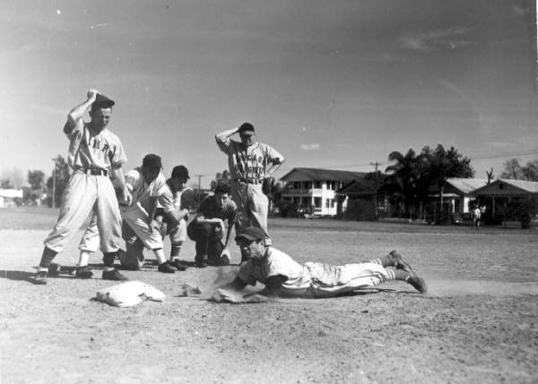 File:Joe Carapezza dives headfirst toward the base with instructor Bitsy Mott watching - Tampa, Florida.jpg