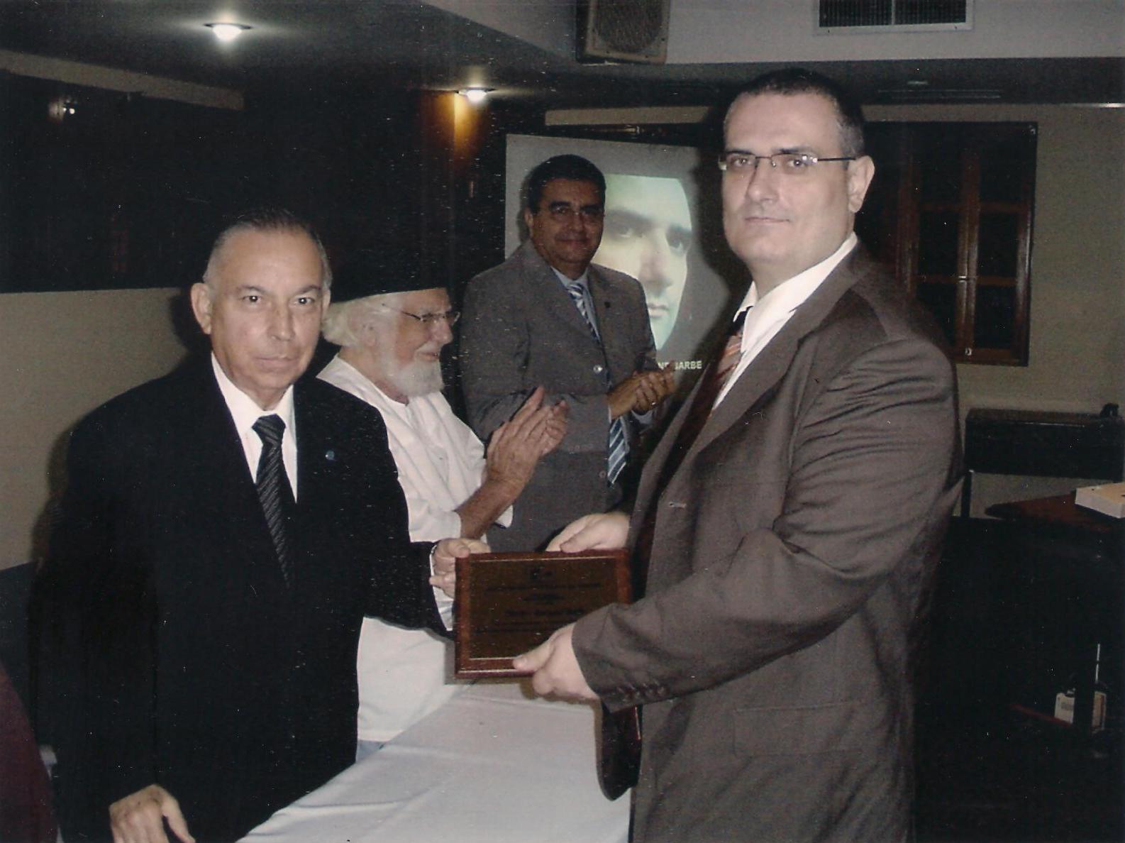 A portrait of '''Norbert-Bertrand Barbe receiving award'''