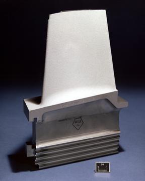 A turbine blade with thermal barrier coating. This blade has no tip shroud so tip leakage is controlled by the clearance between the tip and a stationary shroud ring attached to the turbine case.