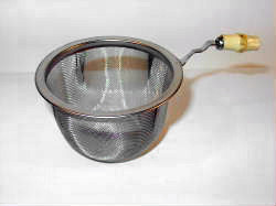 A tea strainer with a bamboo handle