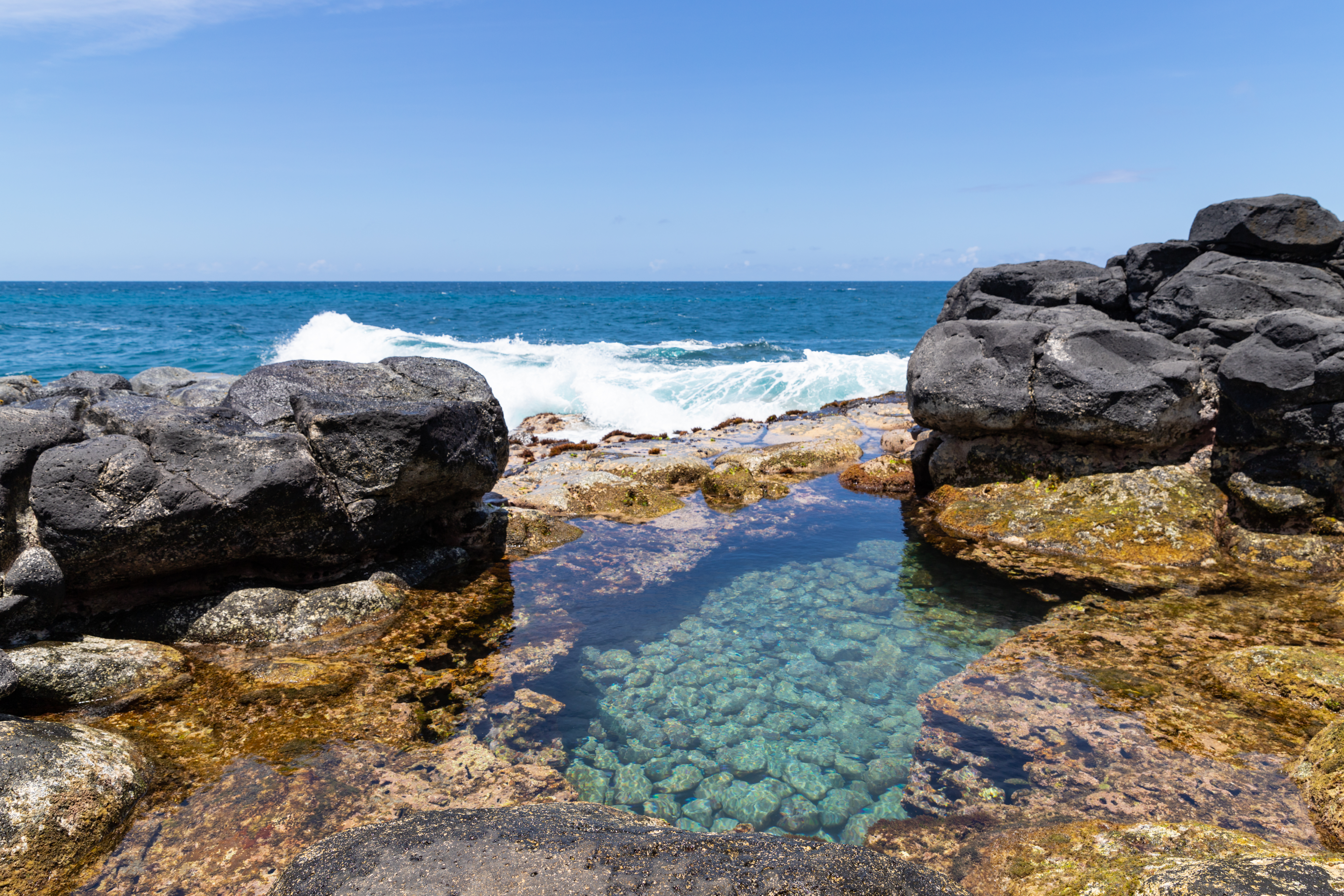 Crystal clear water Queen's Bath pool Princeville Kauai Hawaii (31338573327).jpg
