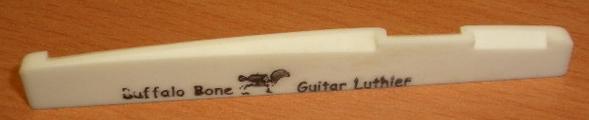 File:Acoutic guitar lower nut.JPG