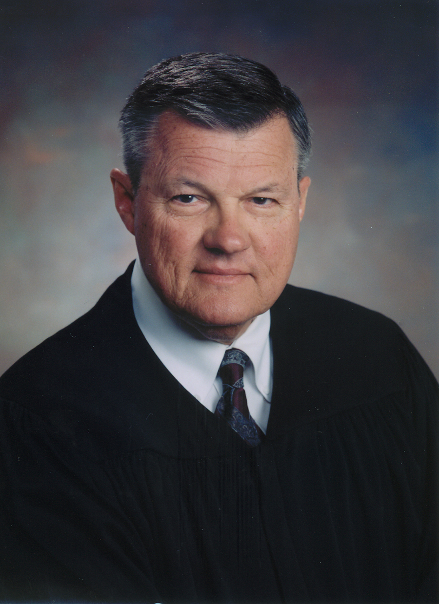 What is the background of Florida circuit judge John Schlesinger?