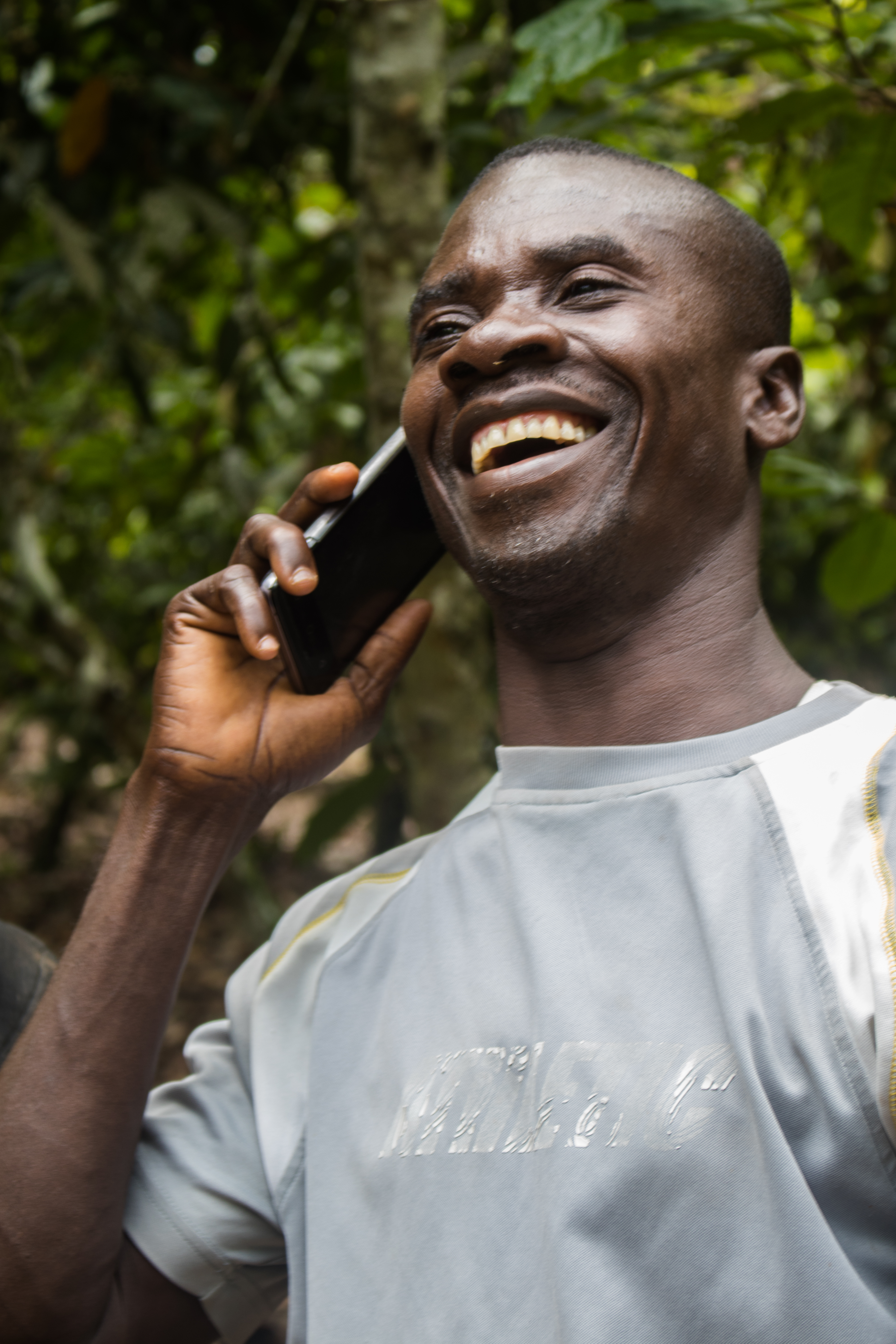 File:Ghanaian Cocoa Farmer on Phone.jpg - Wikimedia Commons