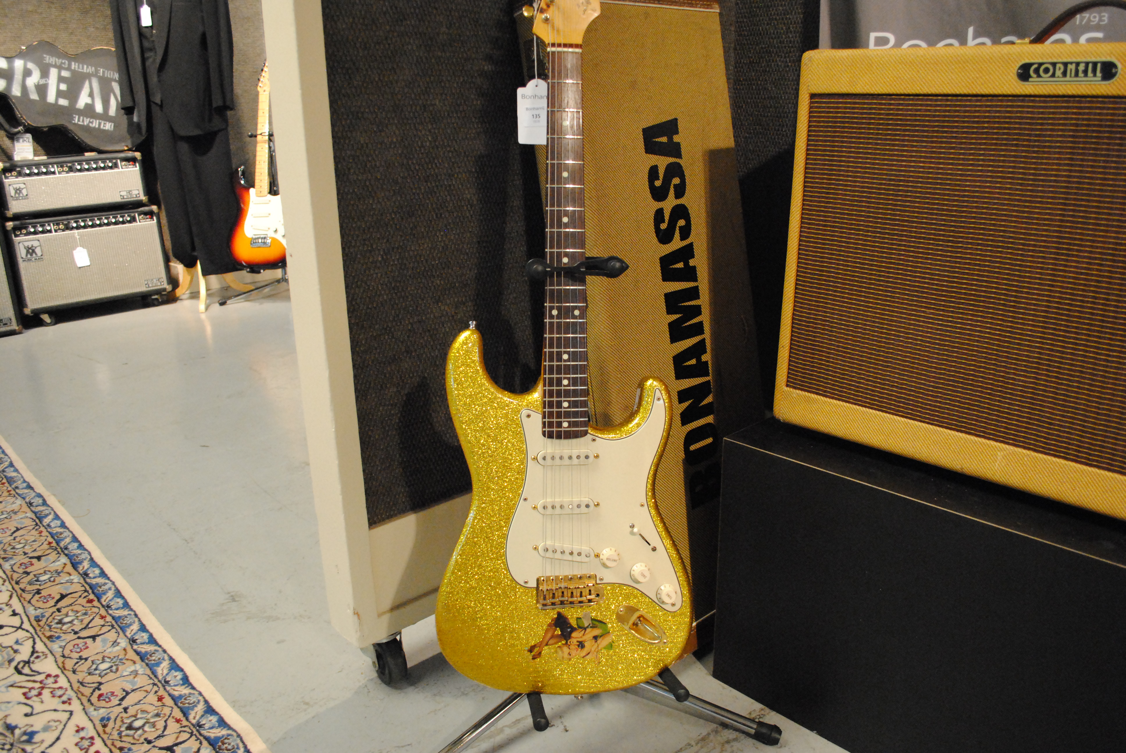 File:Joe Bonamassa's Gold Sparkle Fender Stratocaster (Bonhams auction 19226, lot 135) & 2002 Cornell Custom 80, Serial No. DC-2 (lot 97).jpg - Wikimedia Commons