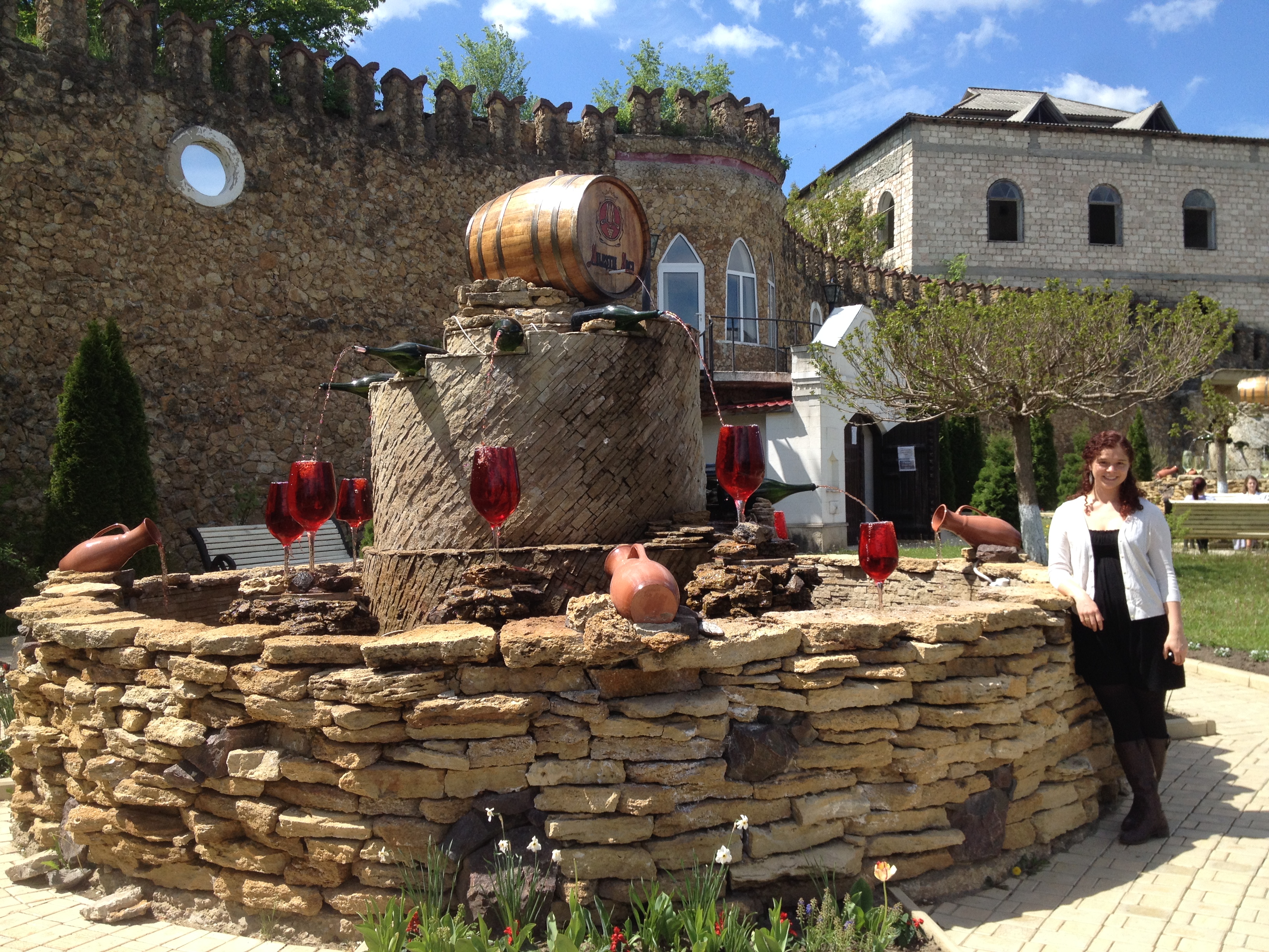 Premium Photo  Decorative fountain in form of pouring wine at the entrance  of milestii mici wine cellars in moldova