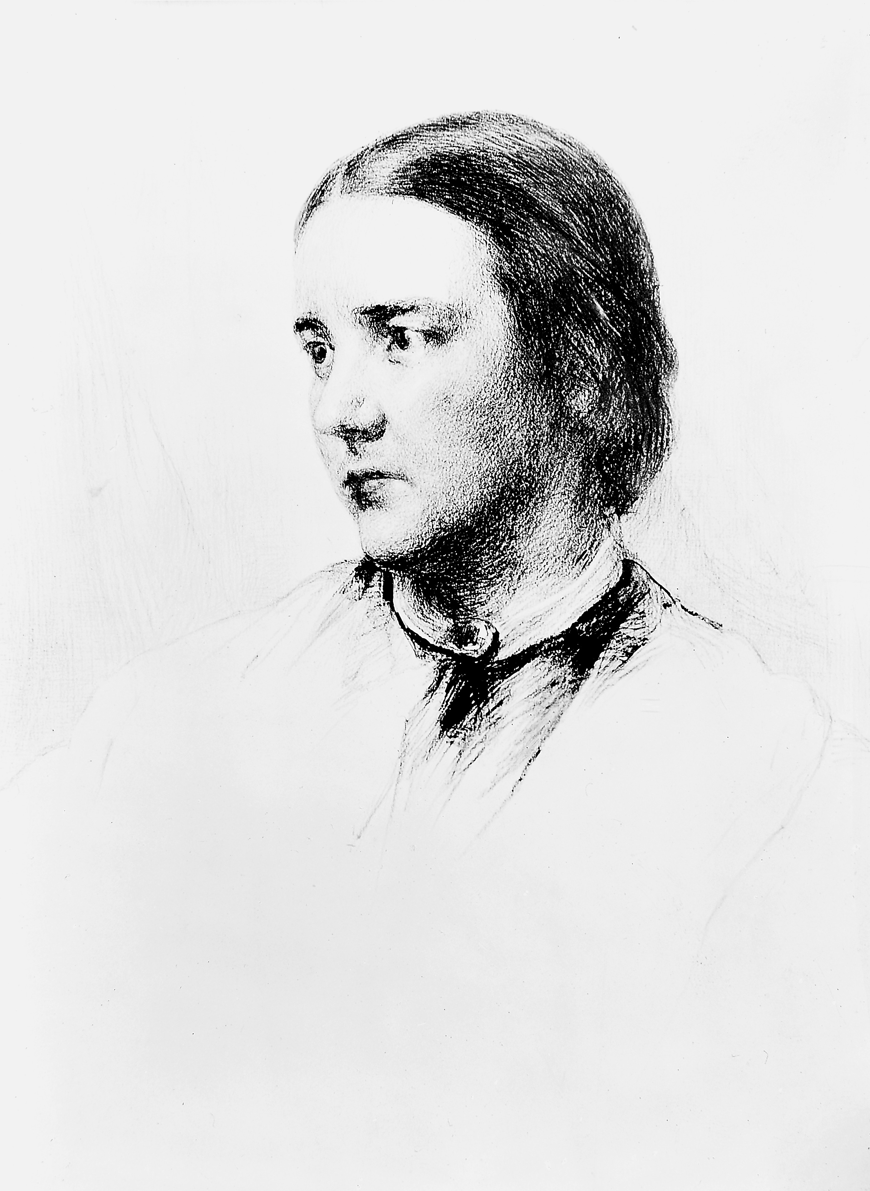 Head and shoulders of a white woman with short dark hair and dark eyes, with her head turned to the left