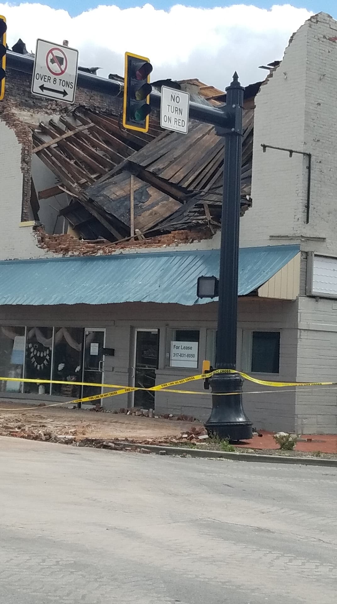 EF1 damage to a brick building into Downtown Mooresville, Indiana.