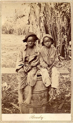 A photograph of two children who likely, were recently emancipated – circa 1870