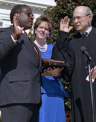 Clarence Thomas being sworn in as a member of the U.S. Supreme Court by Justice Byron White during an October 23, 1991, White House ceremony, as wife Virginia Thomas looks on Virginia Thomas.JPG