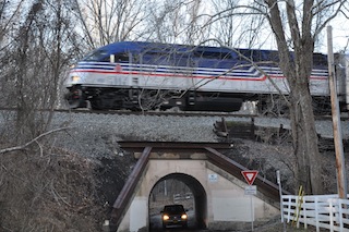 Train_and_vehicular_traffic_at_Colcheste