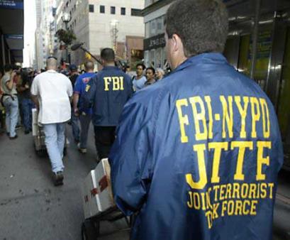 Members of the FBI–NYPD Joint Terrorism Task Force carrying evidence as part of an investigation in the early 2000s