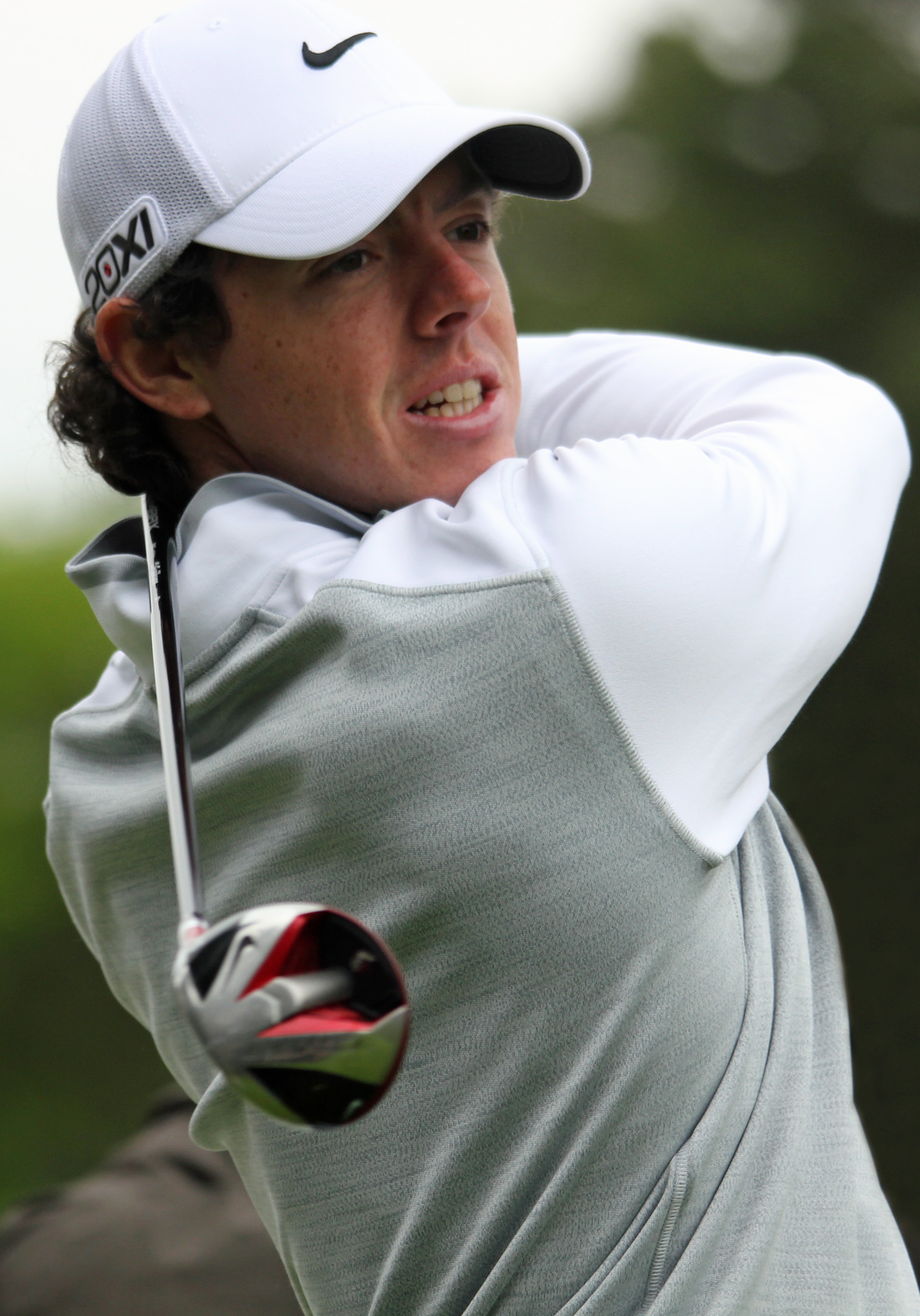 Rory_McIlroy_watches_drive_flight_(portr