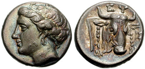 Silver drachma of the Euboean League. Obverse: Head of the nymph Euboea. Reverse: Bull's head and kantharos, with the inscription EY[ΒΟΙΕΩΝ] "of the Euboeans".
