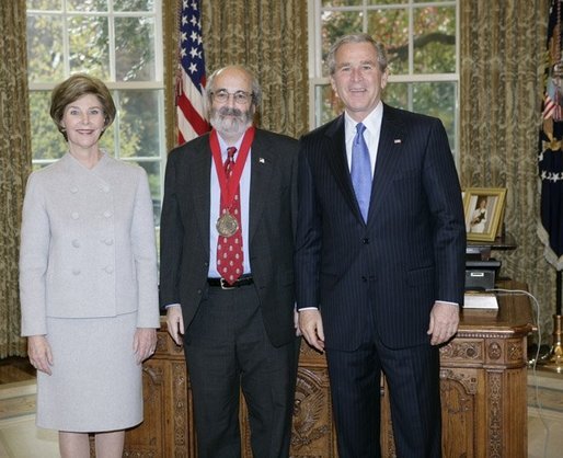President George W. Bush (right) and Laura Bush (left) stand with 2005 National Humanities Medal recipient Alan Charles Kors (center).