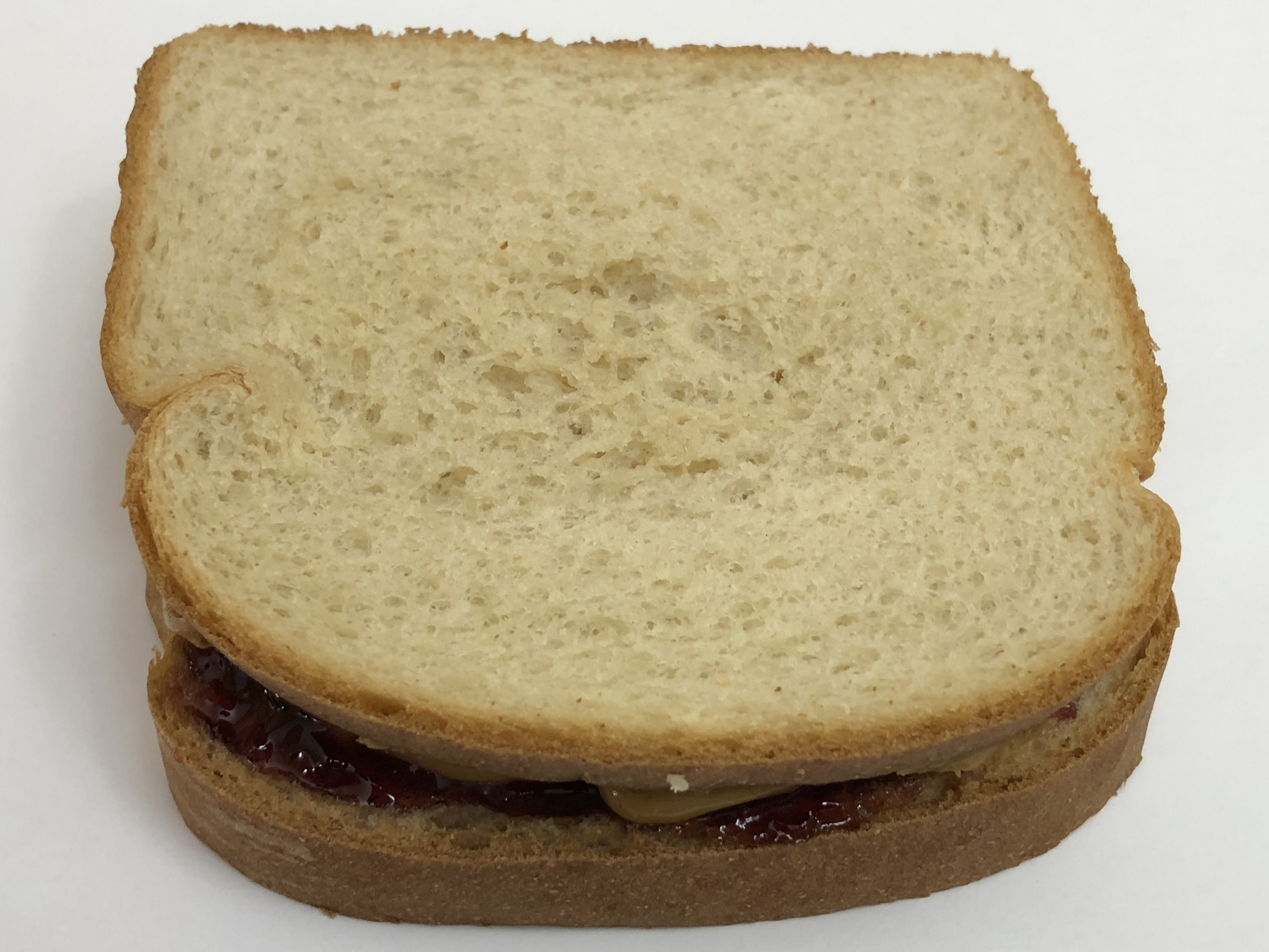 File 05 04 23 56 36 A Peanut Butter And Jelly Sandwich Composed Of Two