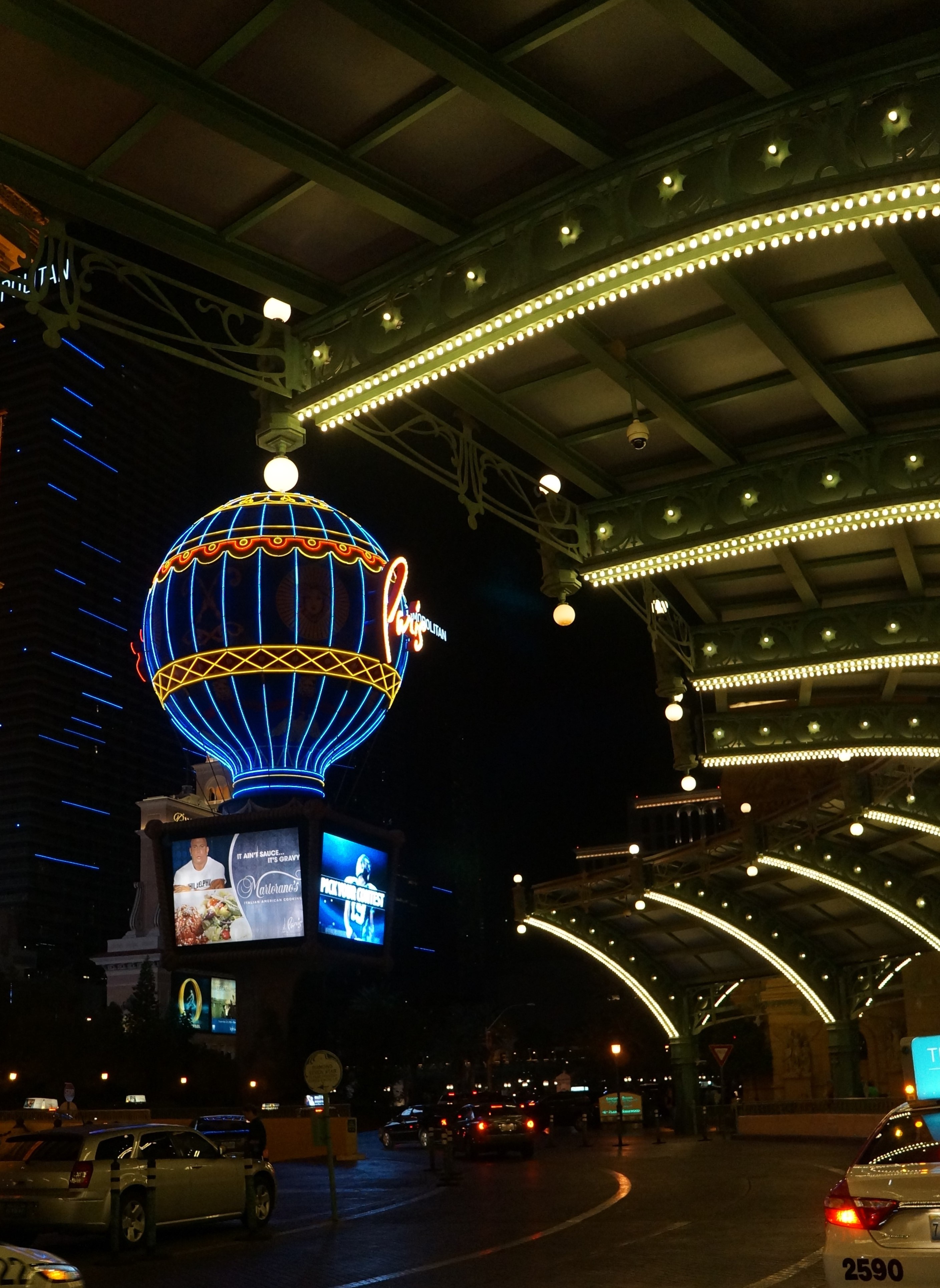 The exterior of the Paris hotel-casino in Las Vegas are lit up