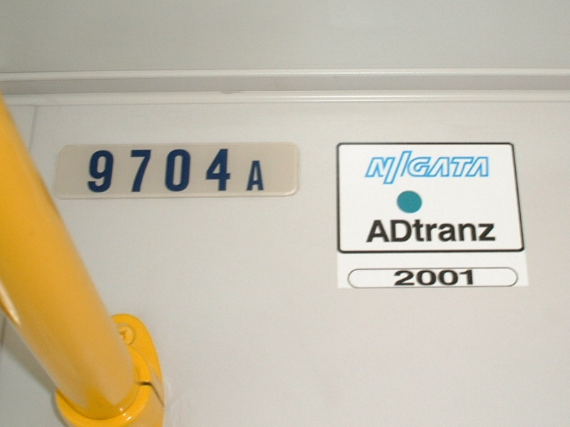 File:Niigata Tekkou-ADtranz builder's sticker (Kumamoto city tram 9700 series).jpg