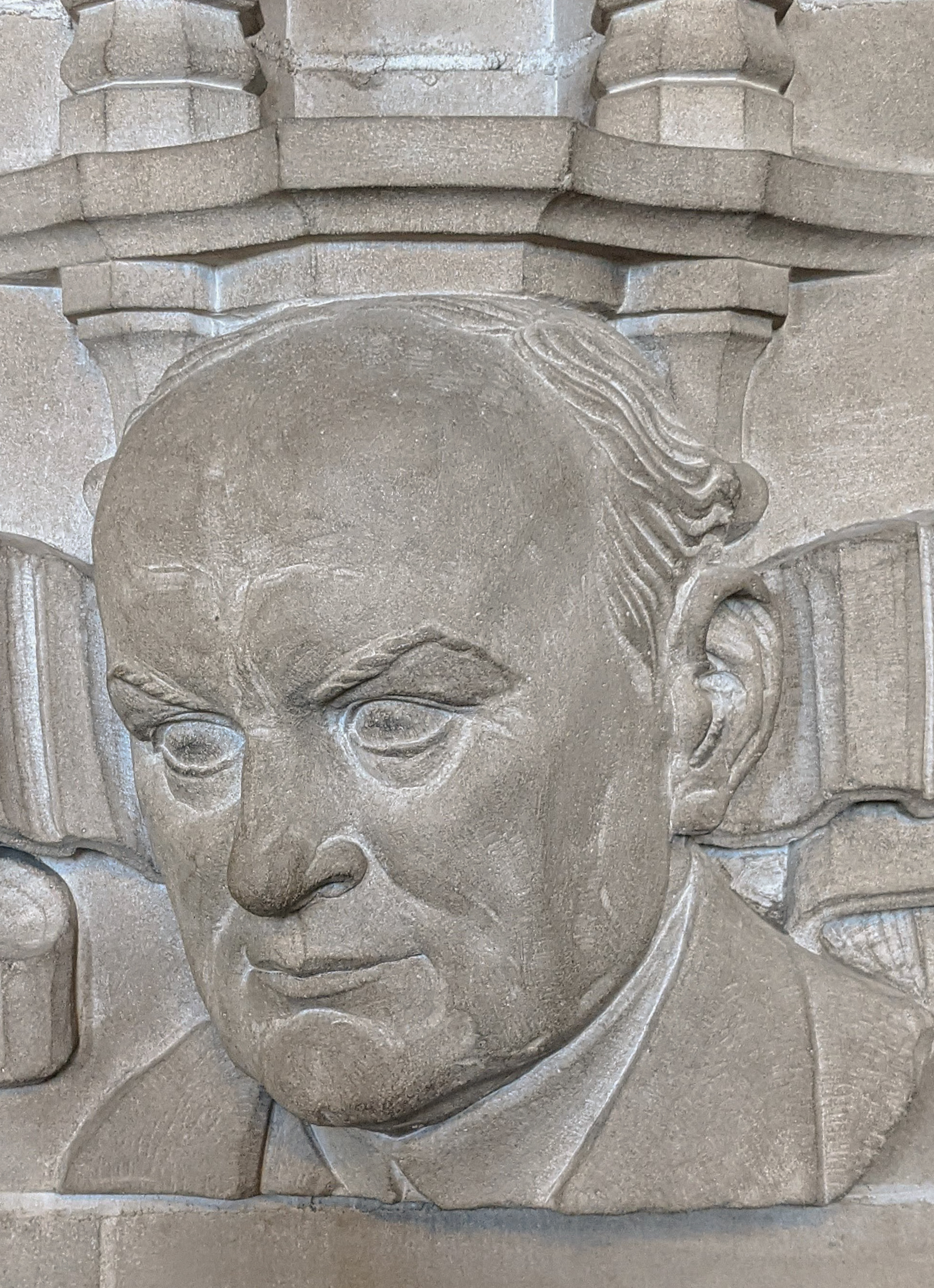 Bust of Theodore Wesley Koch at stack entrance in Deering Library.