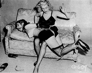 Bettie Page is tied and spanked in an image from the magazine Bizarre (1940s-1950s) Bettie Page in Bizarre Magazine.jpg