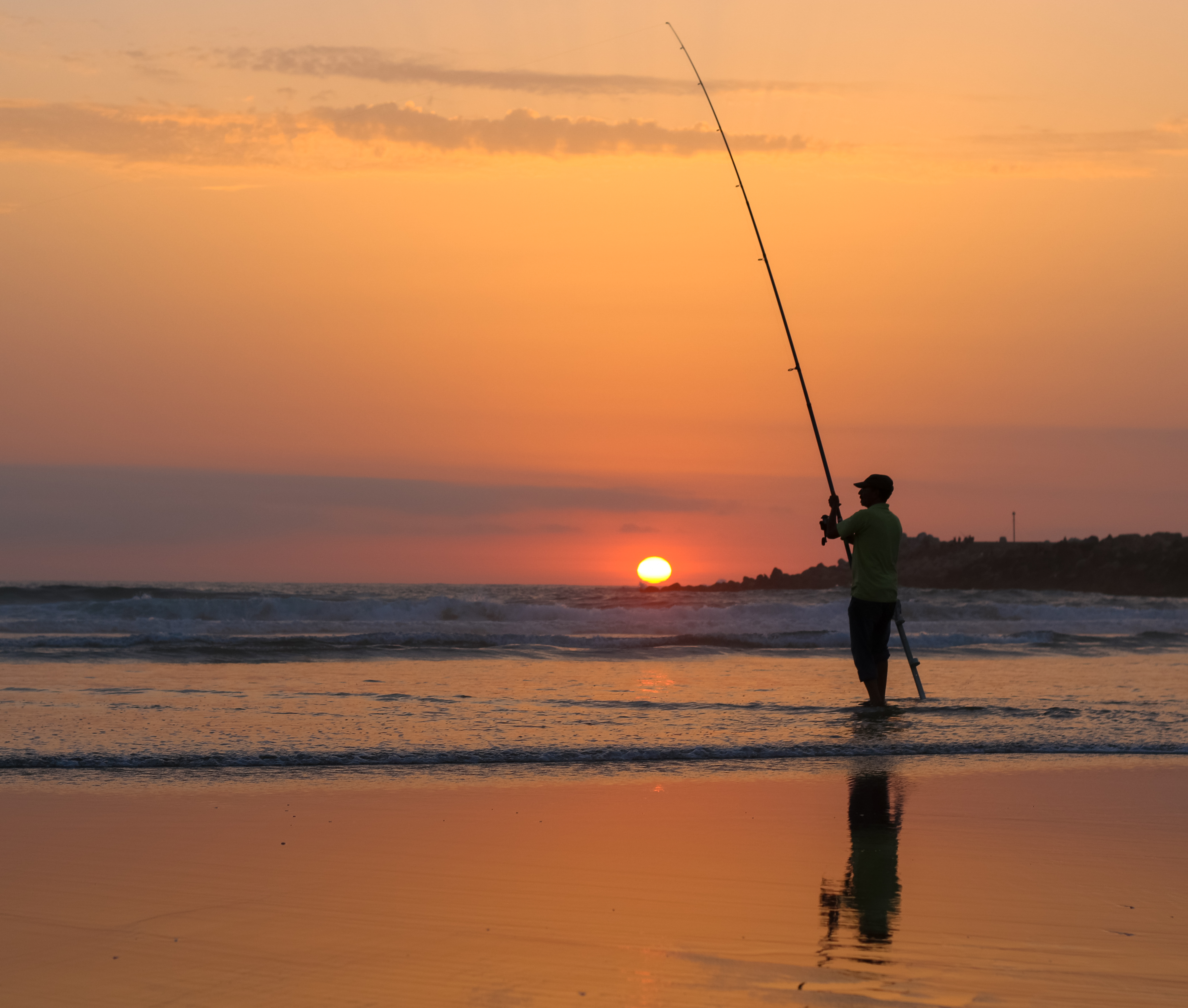 File:Man fishing at sunset in Mehdia beach.jpg - Wikimedia Commons