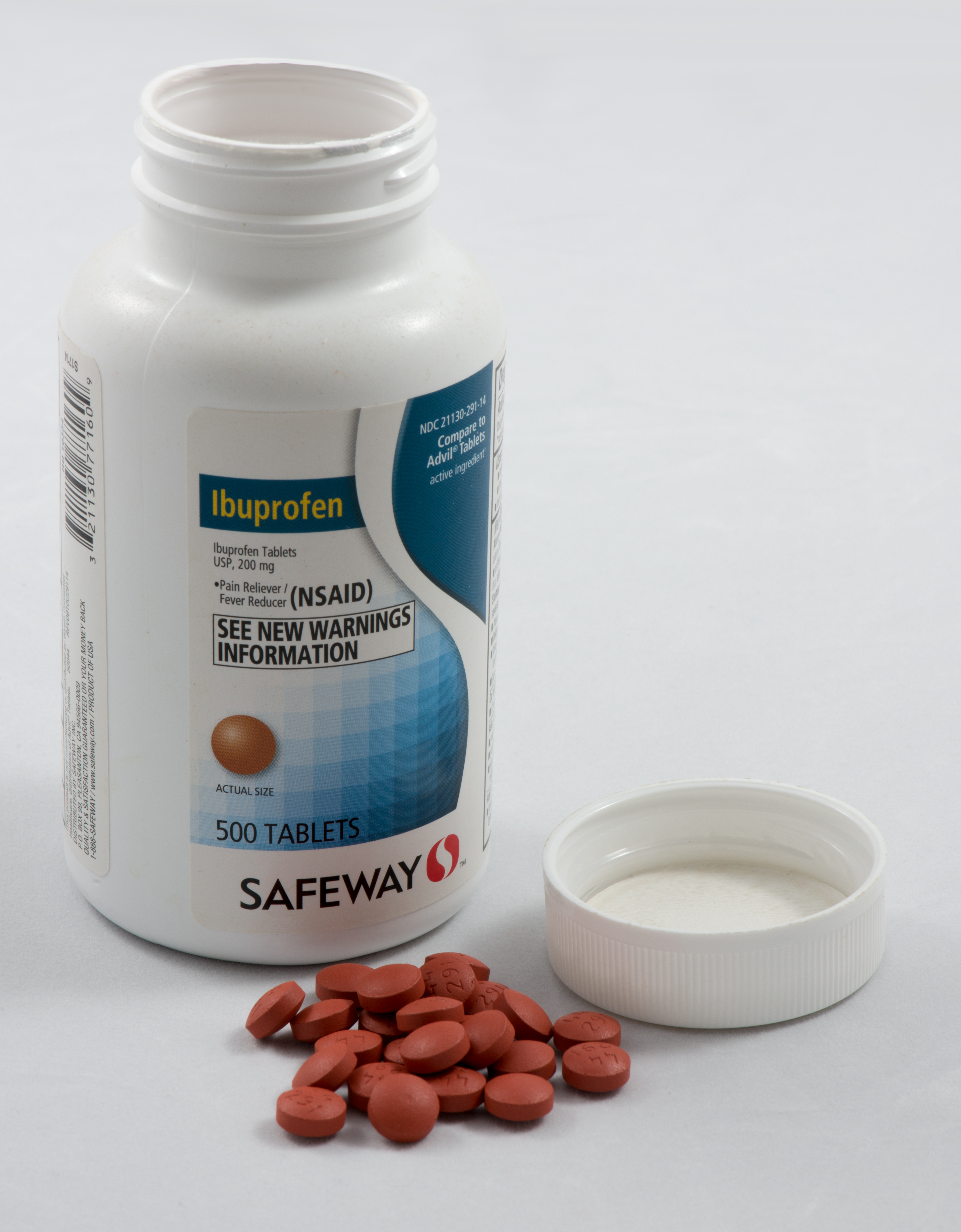Bottle_of_Ibuprofen_tablets_with_cap_removed_and_tablets_in_front