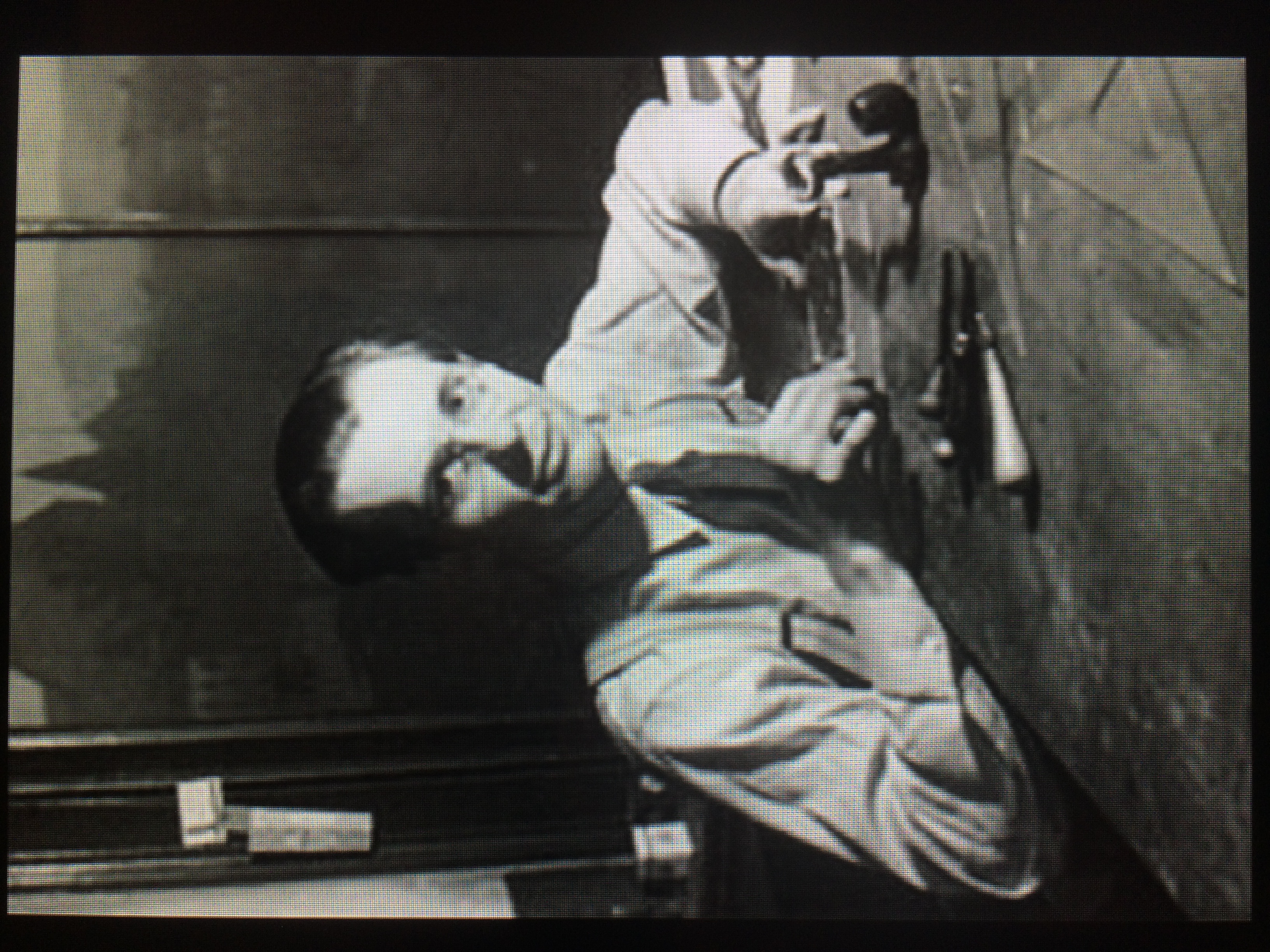 A young Jim Flora at his art desk.