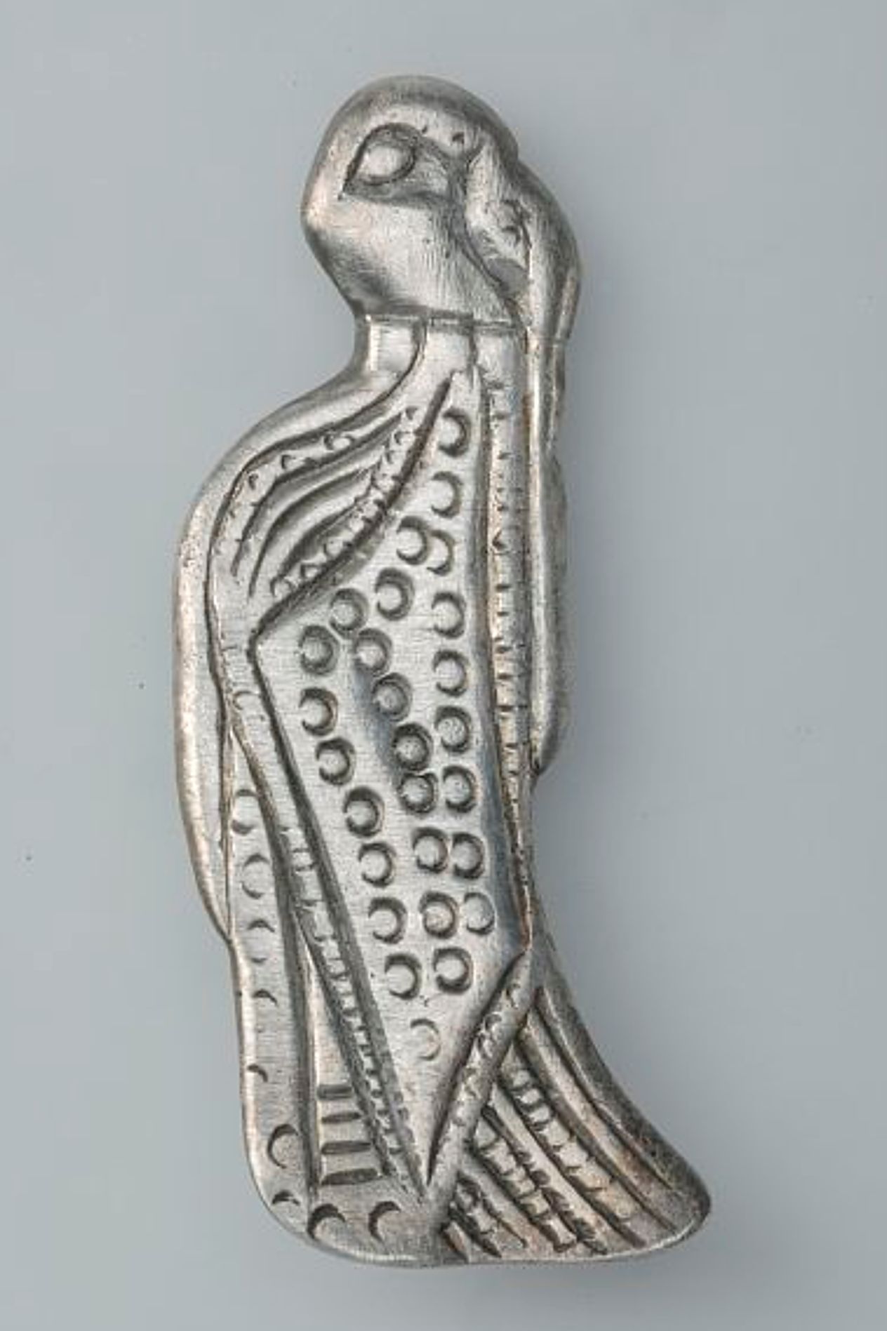 A figure of a valkyrie, carved from silver.