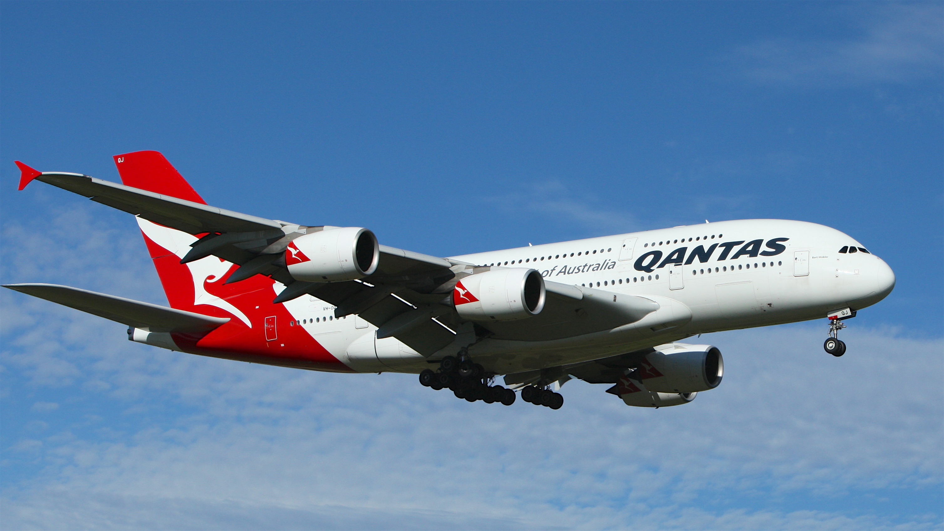 File:White and Red Qantas Airplane Fly High Under Blue and White  Clouds.jpeg - Wikimedia Commons