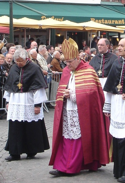Cathedral chapter of Bruges, the bishop and three canons taking part in a procession