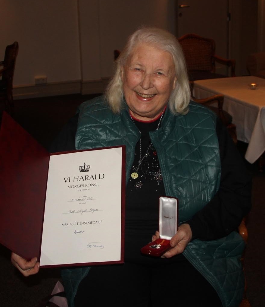 Turid with her Badge of Honour from Norwegian King, HM King Harald VII