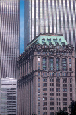 The West Street Building in 1988, overshadowed by the modernist World Trade Center