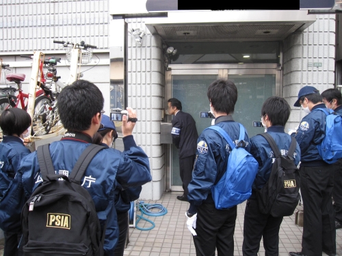 PSIA officers make an inspection to a suspected Aum Shinrikyo building in 2012.